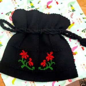 PURSEHas floral of red/green on this draw string bag. VERY CHIC. Black&Beautiful
